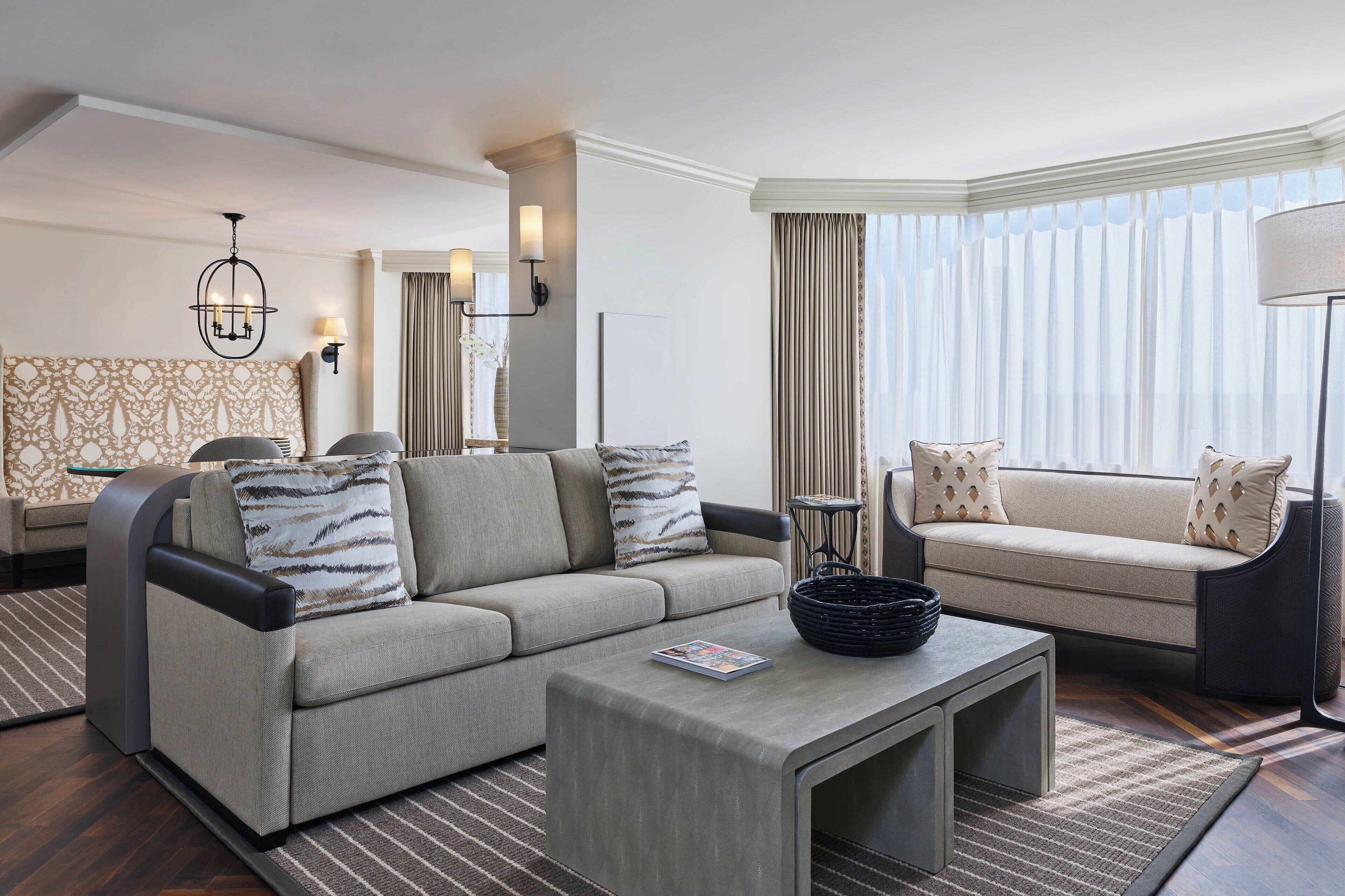 A modern living room with a sofa, a coffee table, and a side table.