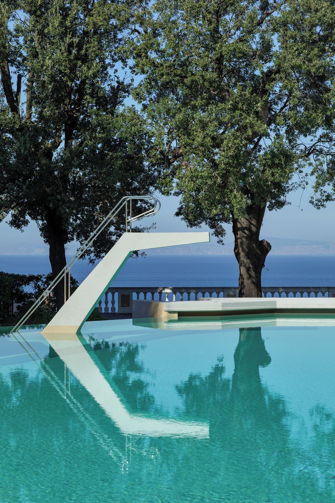 Seasonal outdoor pool, pool umbrellas, pool loungers