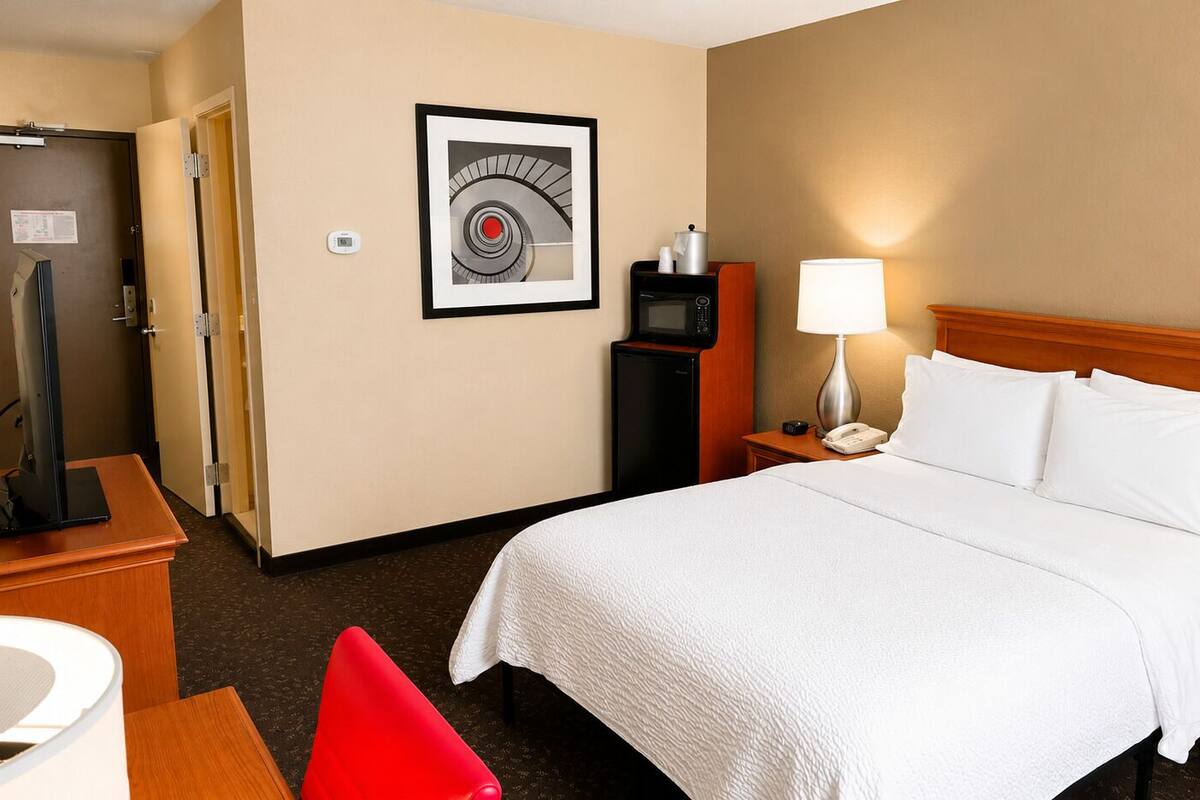 Premium bedding, desk, laptop workspace, blackout curtains
