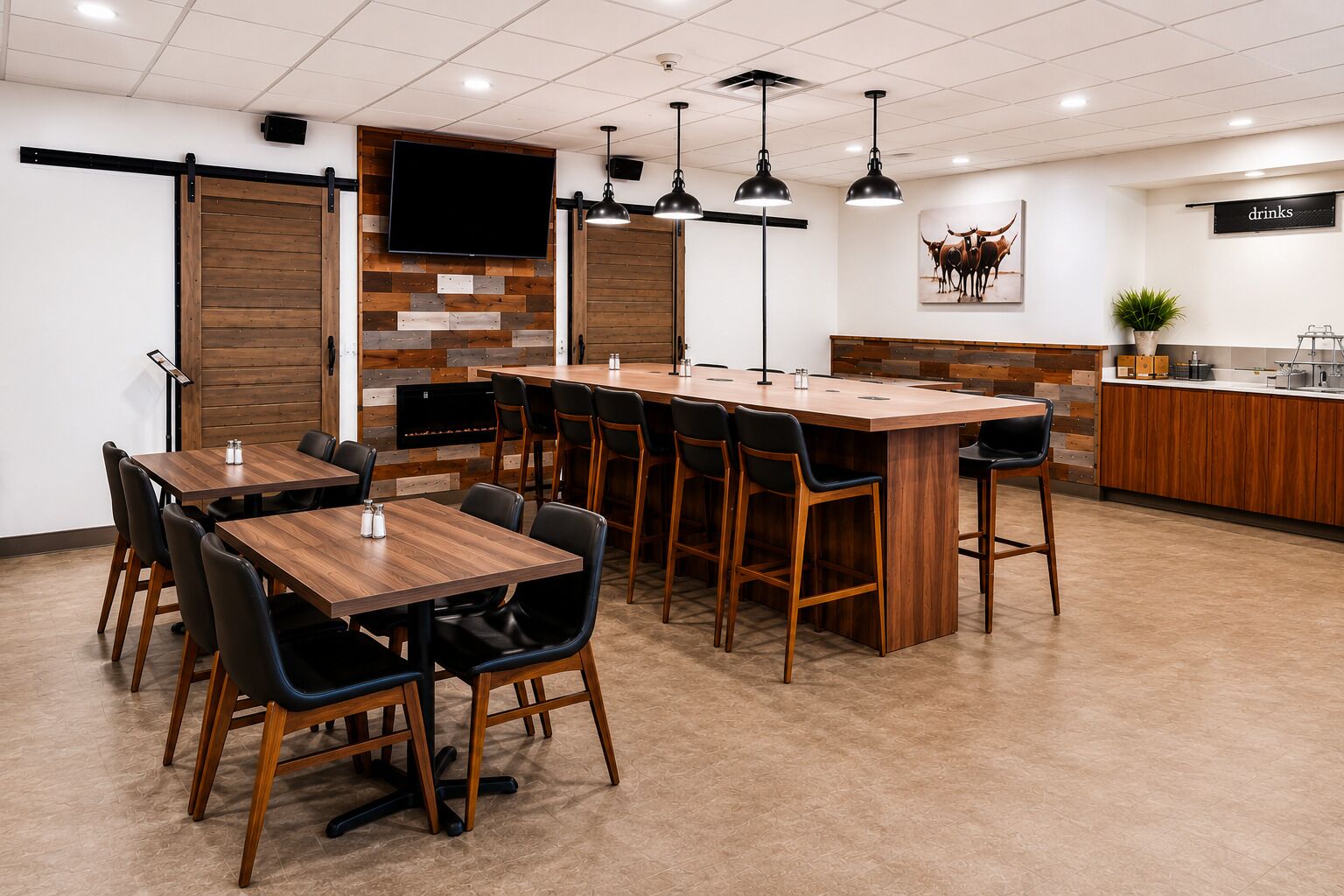 Un restaurante moderno con una barra de madera alargada, sillas negras y un televisor de pantalla plana en la pared.