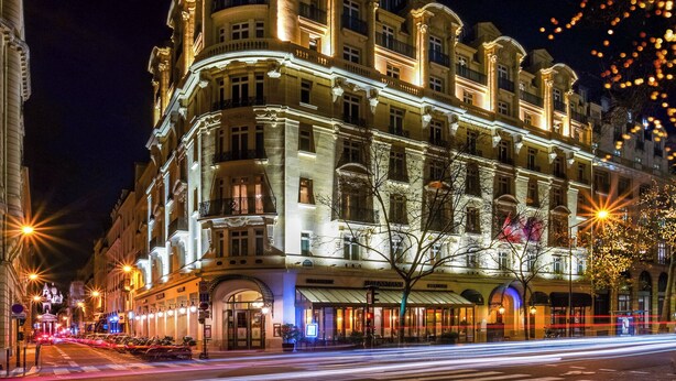 A historic building with ornate architecture, featuring multiple balconies and a prominent entrance. - M Social Hotel Paris (Paris)