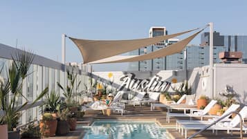 Outdoor pool, open 6:00 AM to 10:00 PM, pool loungers