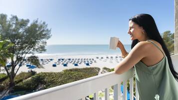 On the beach, white sand, sun loungers, beach umbrellas
