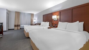 A hotel room with two beds, a desk, a chair, and a lamp. - Comfort Inn Fergus Falls (Fergus Falls)