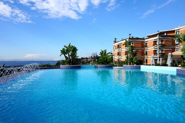 Seasonal outdoor pool, pool umbrellas, pool loungers
