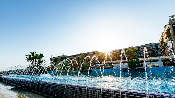 Seasonal outdoor pool, pool umbrellas, pool loungers