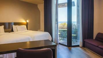 Deluxe Room, 2 Twin Beds, Balcony, Sea View | Down comforters, minibar, in-room safe, desk