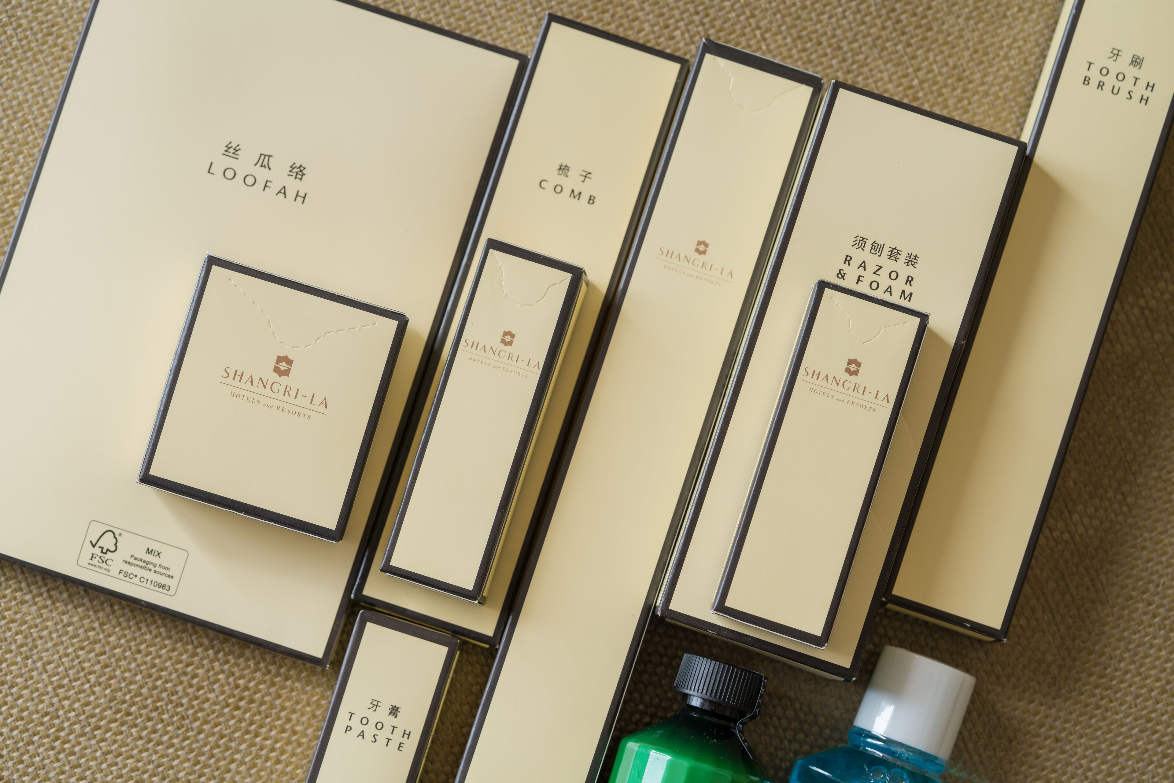 A collection of neatly arranged product boxes with labels indicating various grooming products.