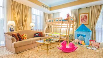 Cozy space for kids, featuring a bunk bed, playhouse, and toys.