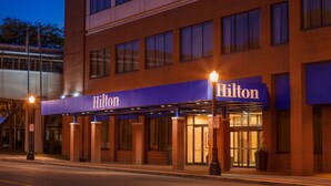 A brick building with a 'Hilton' sign above the entrance. - Hilton Fort Wayne at the Grand Wayne Convention Center (Fort Wayne)