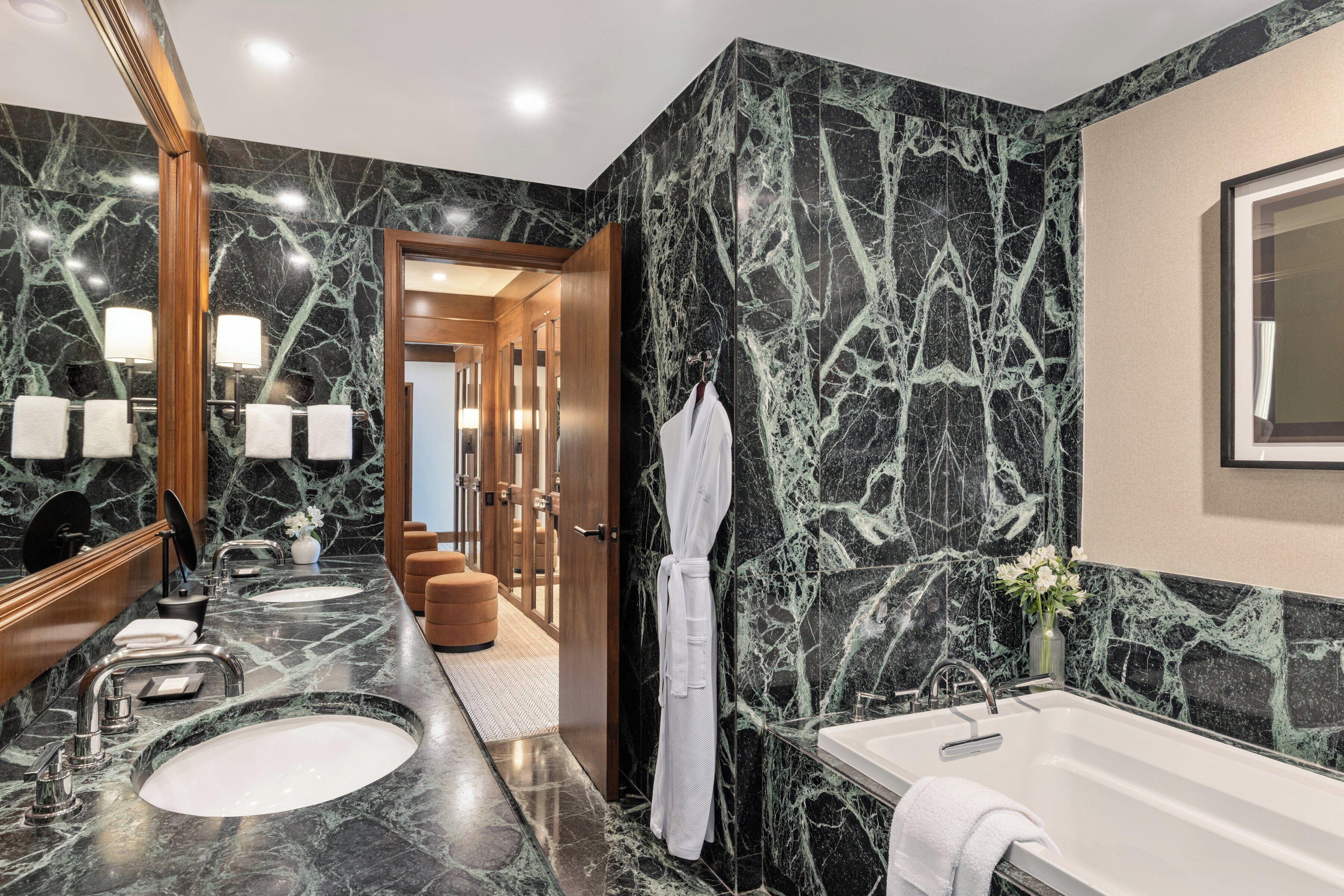 combined shower/bathtub, designer toiletries, hair dryer, bathrobes