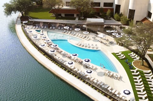 Outdoor pool, open 6:00 AM to 10:00 PM, cabanas (surcharge)