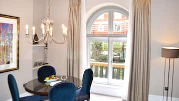 Suite, 1 Bedroom (Minsters) | Living room | 32-inch LCD TV with satellite channels, TV, DVD player