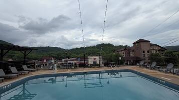 Seasonal outdoor pool, pool umbrellas, pool loungers