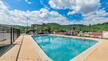 Seasonal outdoor pool, pool umbrellas, pool loungers