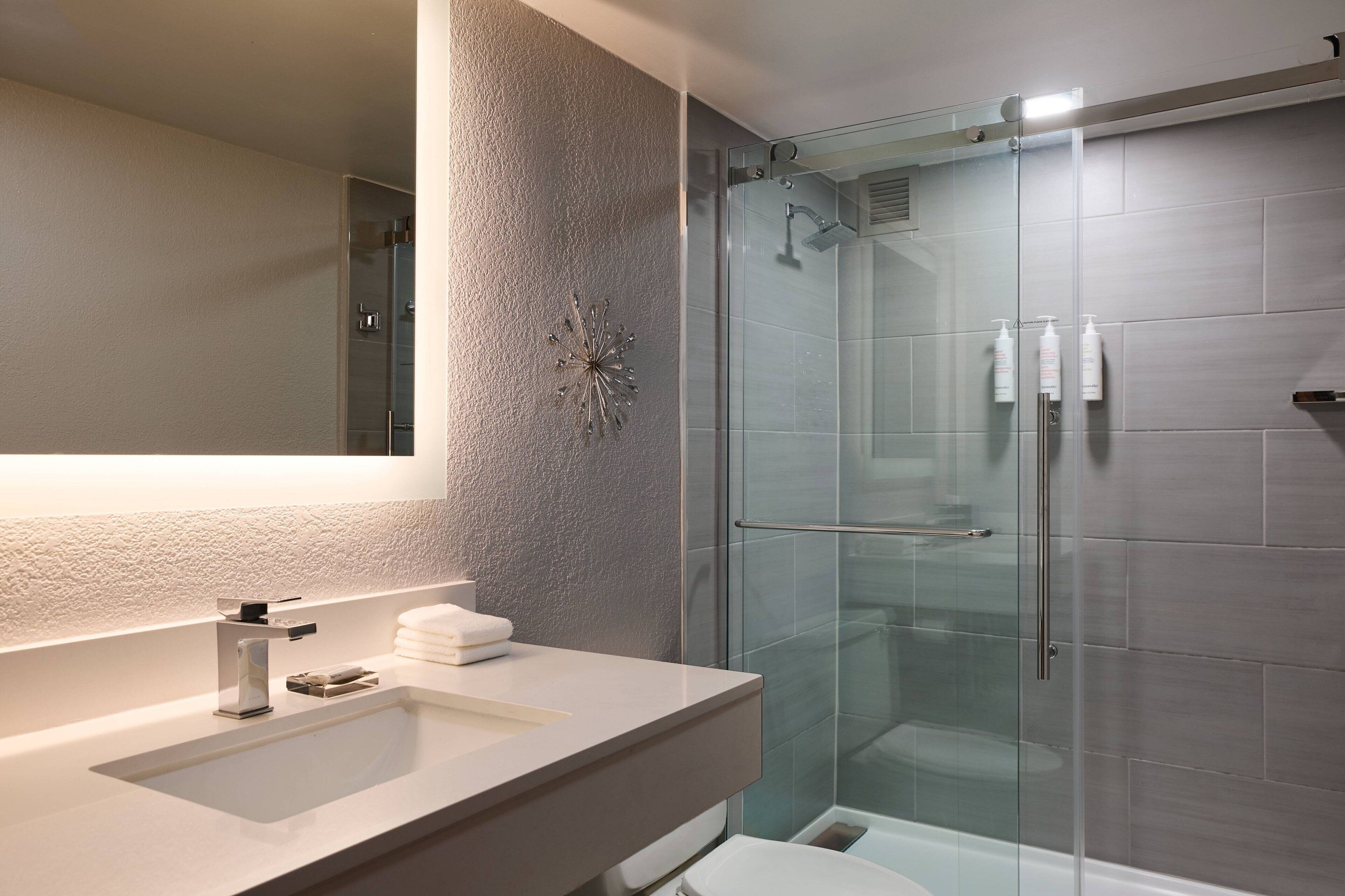 eco-friendly toiletries, hair dryer, towels, soap