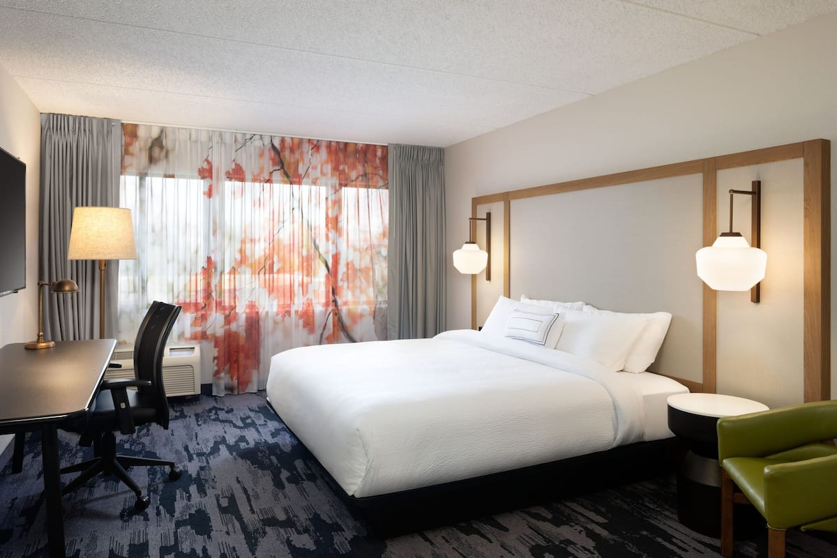 Premium bedding, desk, laptop workspace, iron/ironing board