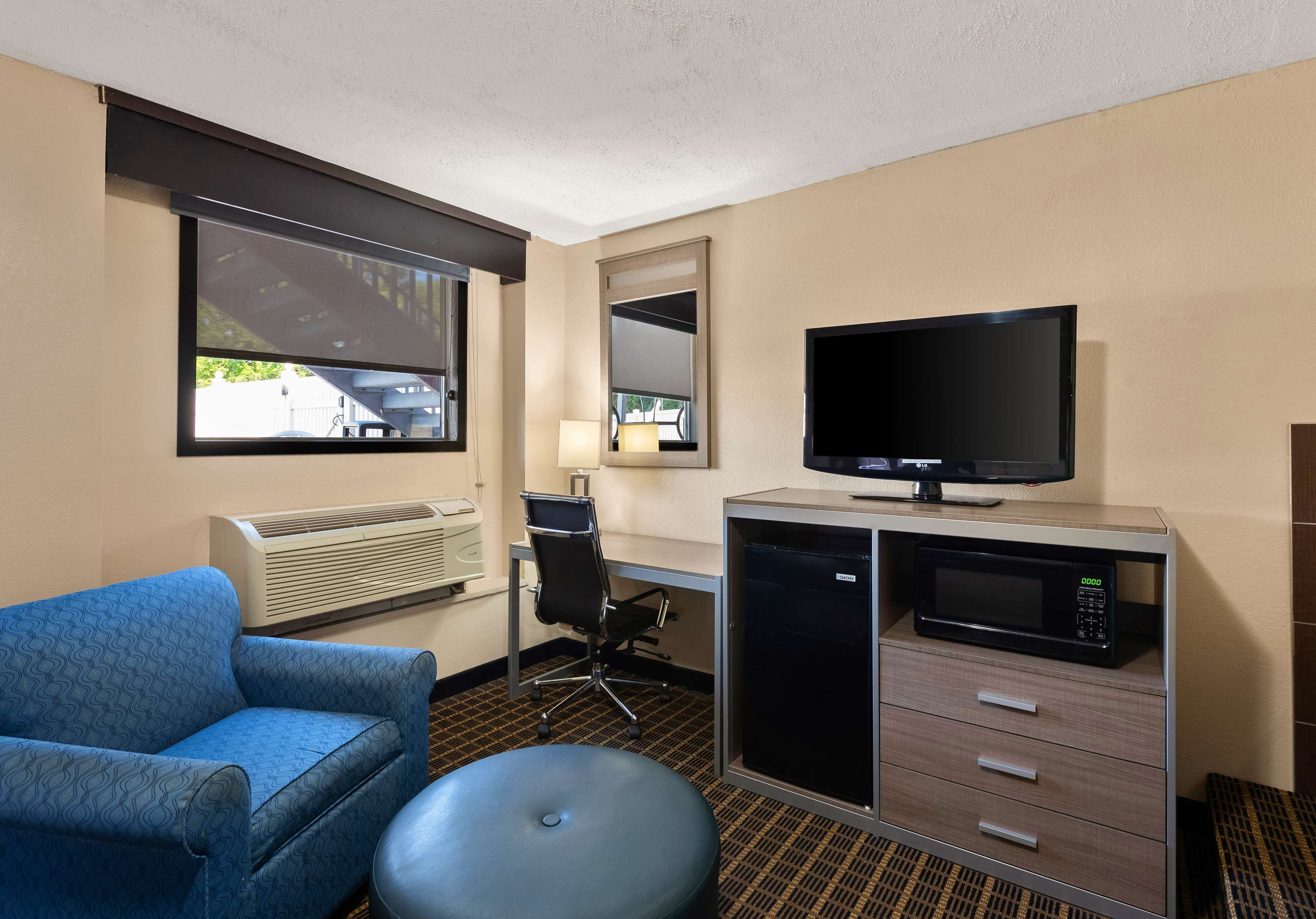 Suite, 2 Queen Beds, Non Smoking, Jetted Tub | Desk, laptop workspace, iron/ironing board, WiFi