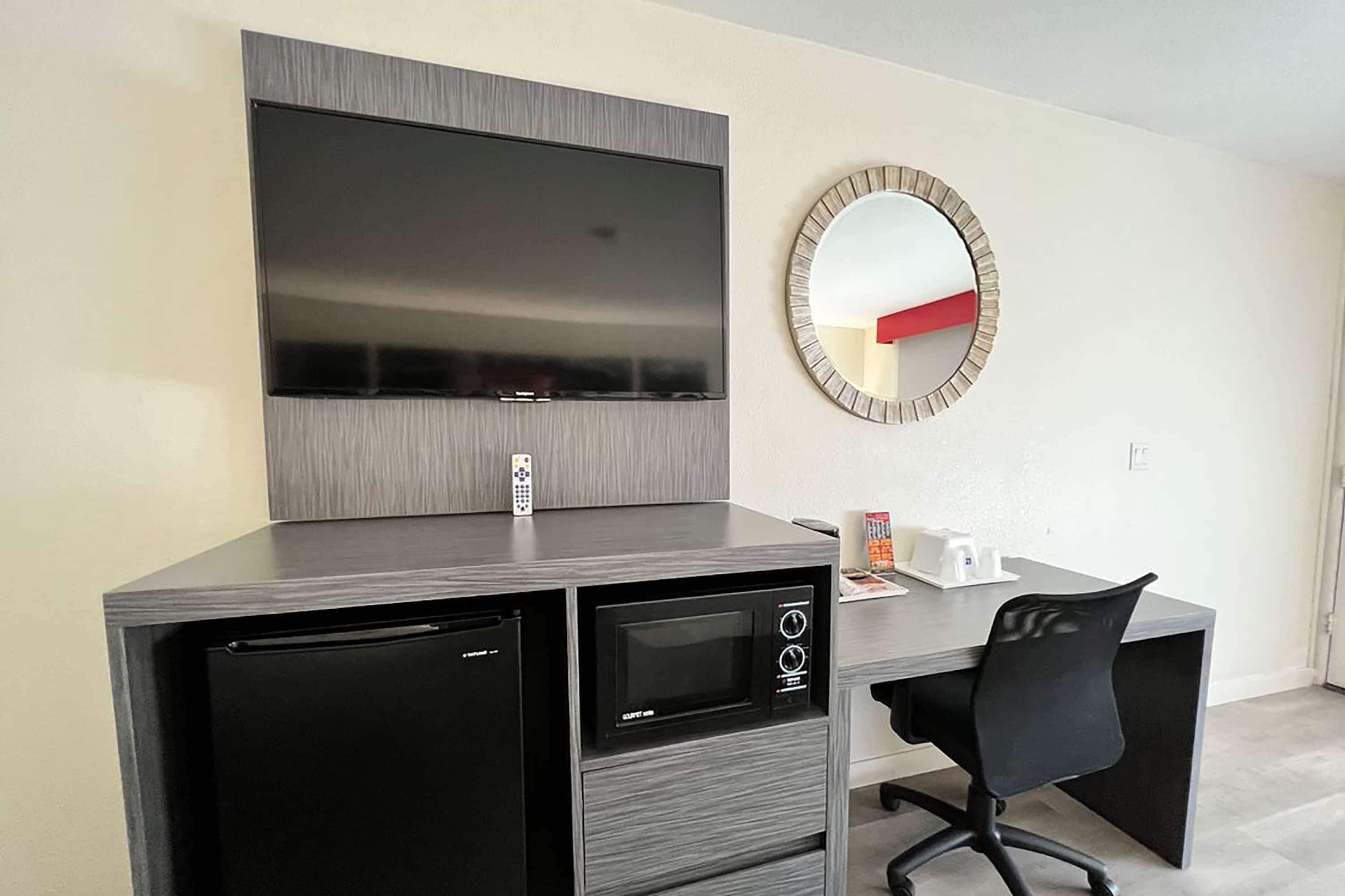 desk, laptop workspace, iron/ironing board, cots/infant beds