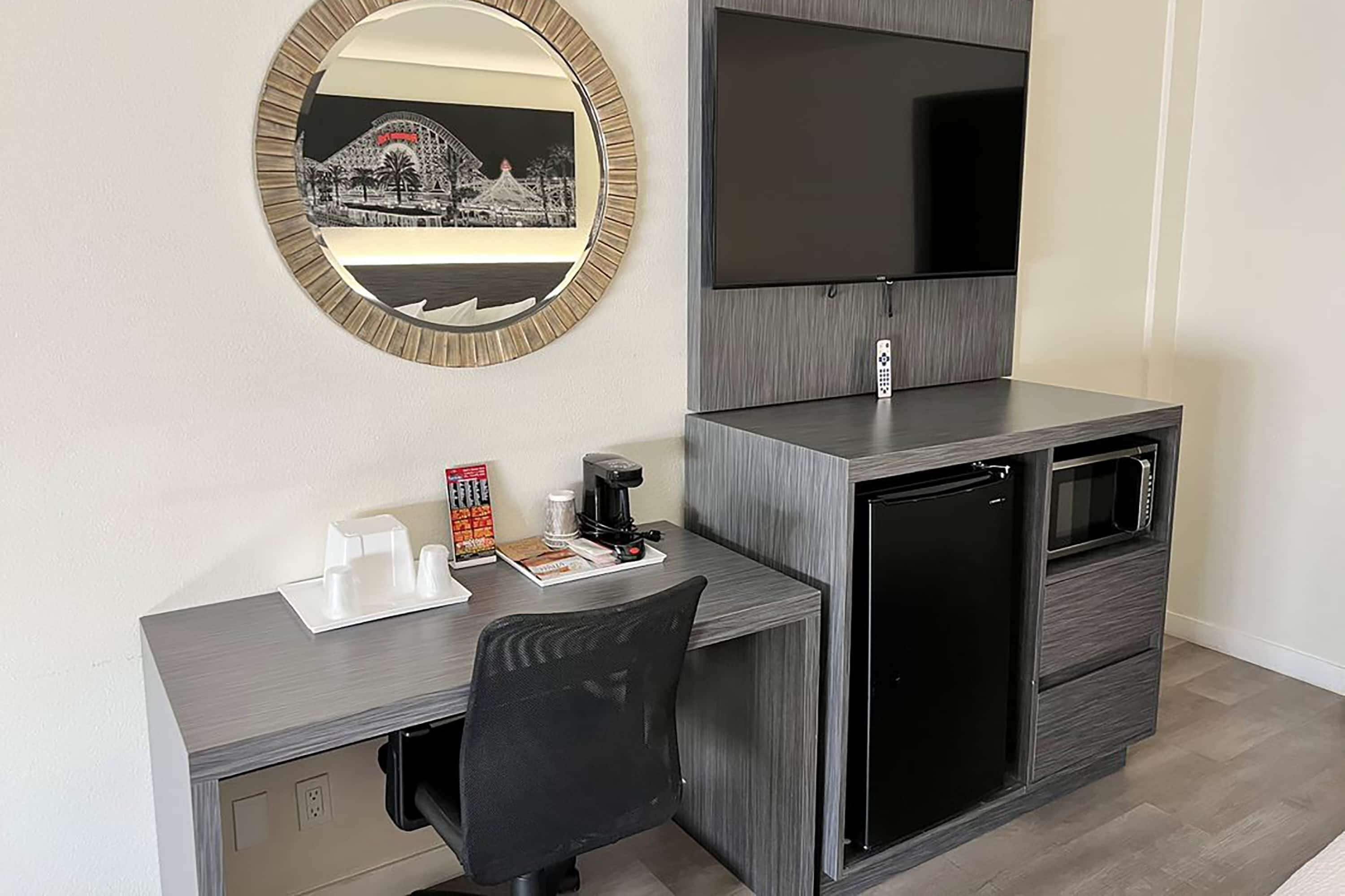 desk, laptop workspace, iron/ironing board, cots/infant beds