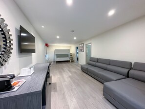 Family Suite, 2 Bedrooms, Non Smoking (1 King, 1 Queen and 1 Bunk Bed) | Living area | TV