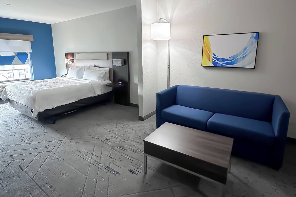 suite, 1 king bed with sofa bed (living area) | in-room safe, desk, iron/ironing board, free cots/infant beds