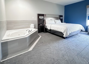 Standard Room, 1 King Bed, Jetted Tub | In-room safe, desk, iron/ironing board, free cribs/infant beds