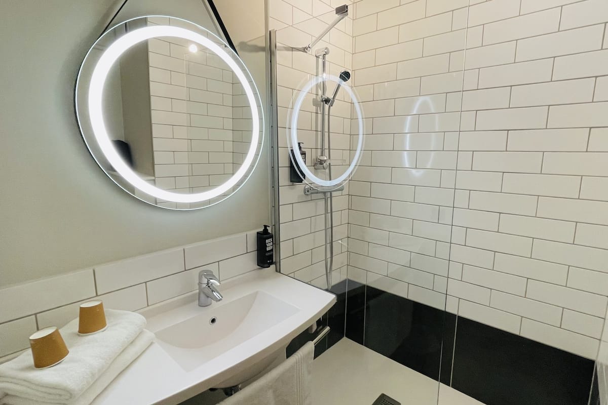 eco-friendly toiletries, hair dryer, towels, soap