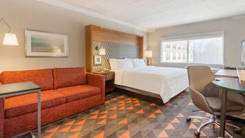 Premium bedding, desk, laptop workspace, blackout drapes