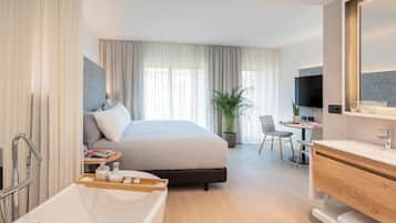 Luxe beddengoed, een minibar met enkele gratis items