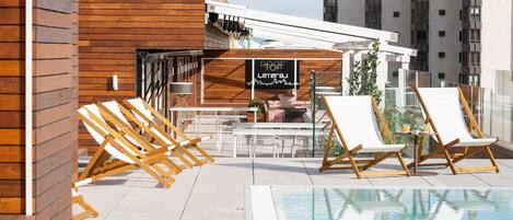 Seasonal outdoor pool, pool umbrellas, pool loungers