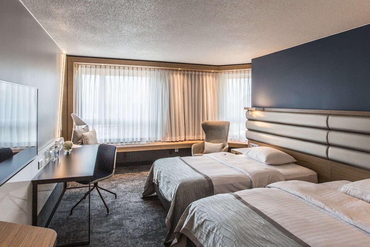 premium twin room, 2 single beds | bathroom | eco-friendly toiletries, hair dryer, bathrobes, slippers