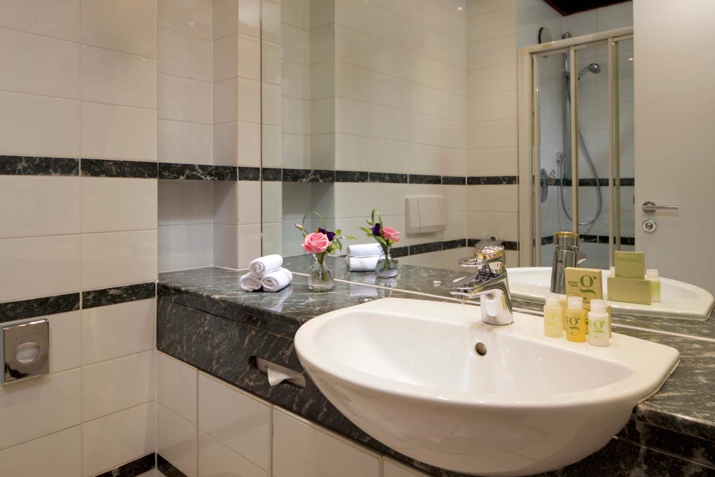 eco-friendly toiletries, hair dryer, towels