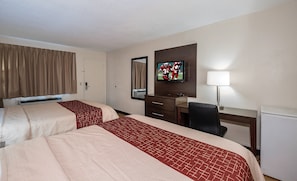 A hotel room with two beds, a desk, a chair, a television, and a lamp. - Red Roof Inn Dayton - Huber Heights (Dayton)
