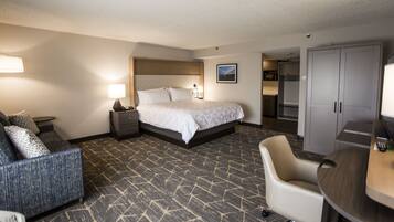 Hypo-allergenic bedding, desk, laptop workspace, blackout drapes
