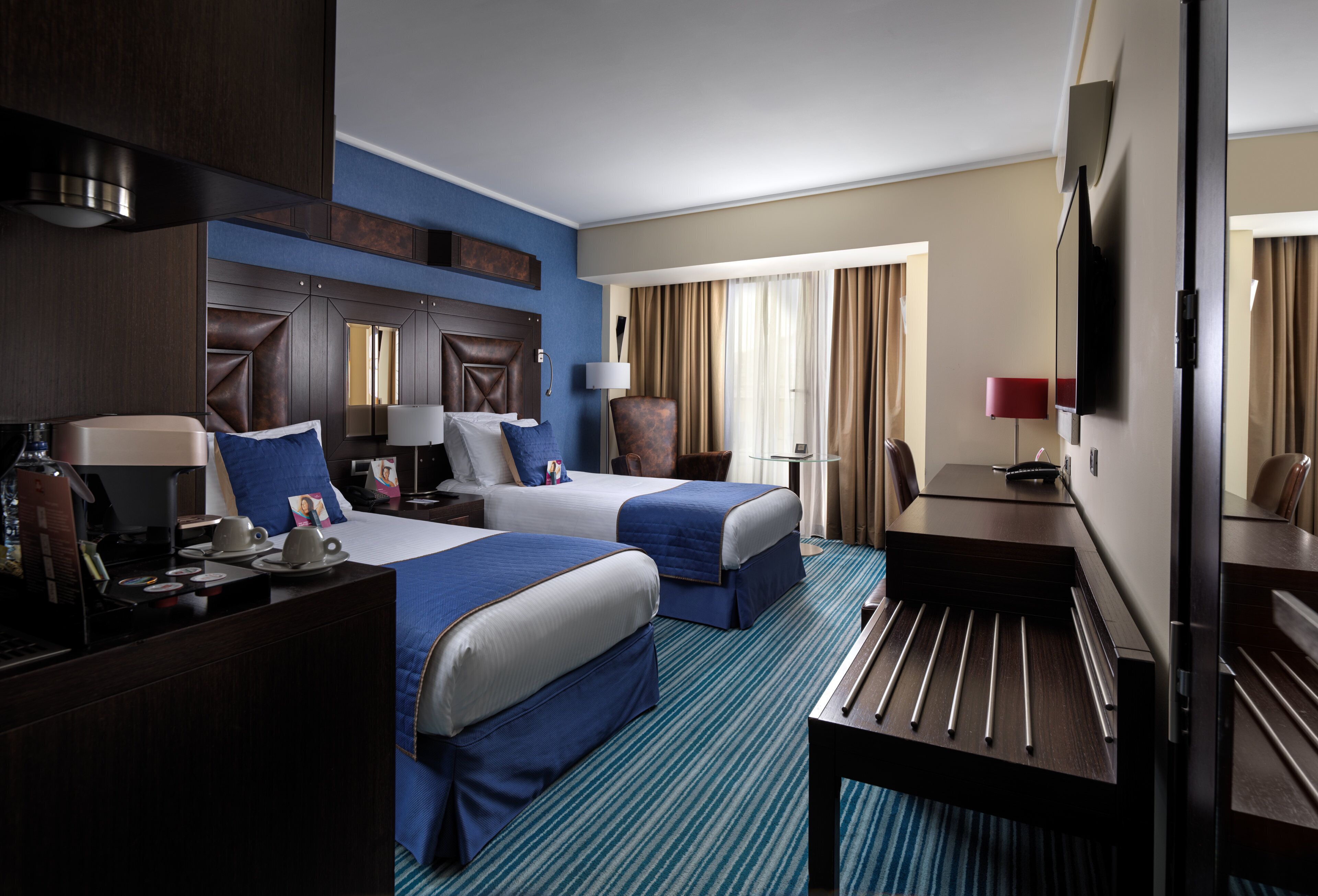 premium bedding, down duvets, tempur-pedic beds, minibar