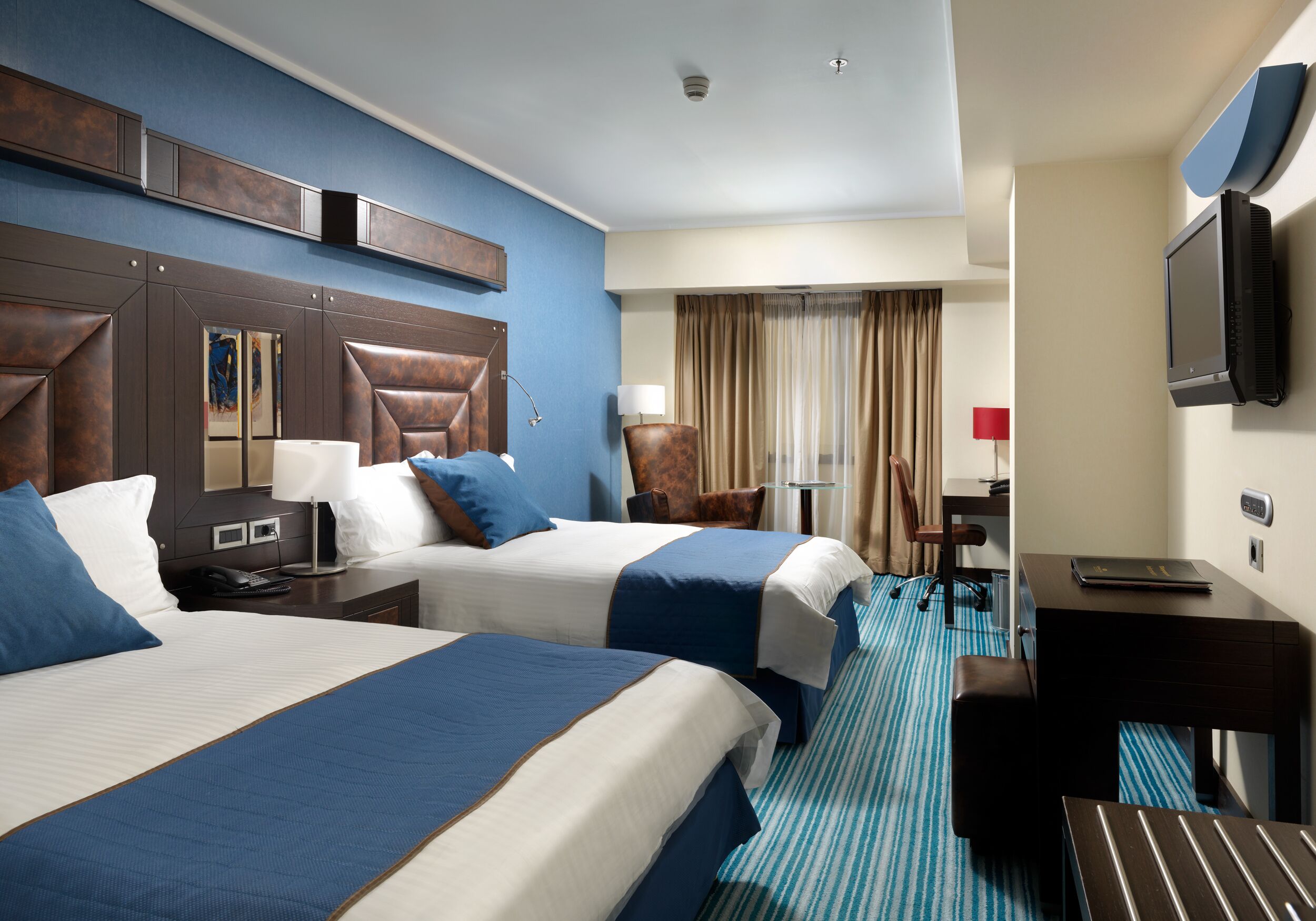 Premium bedding, down comforters, Tempur-Pedic beds, minibar