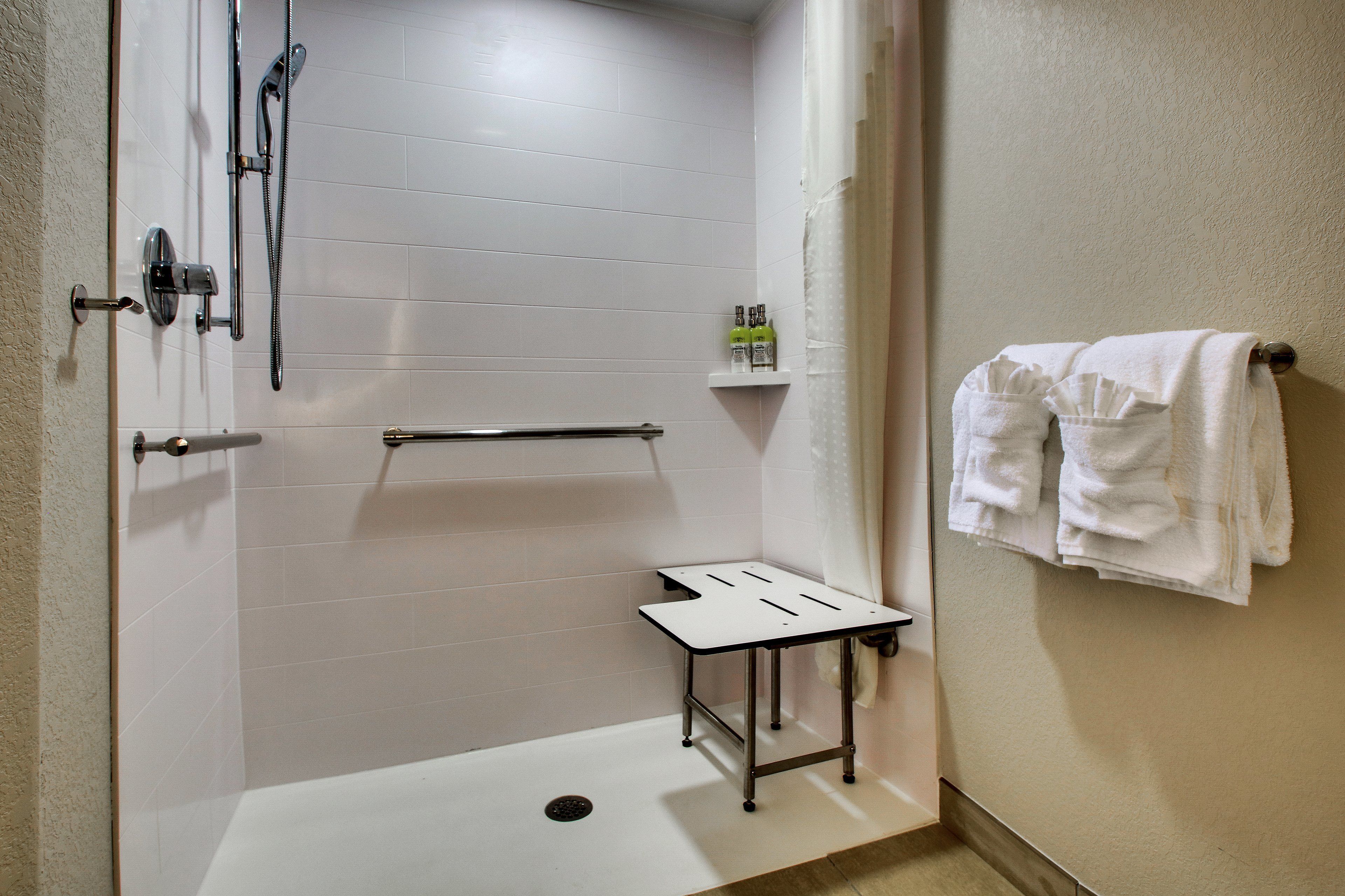 room, 1 king bed, roll-in shower (communications) | bathroom | eco-friendly toiletries, hair dryer, towels