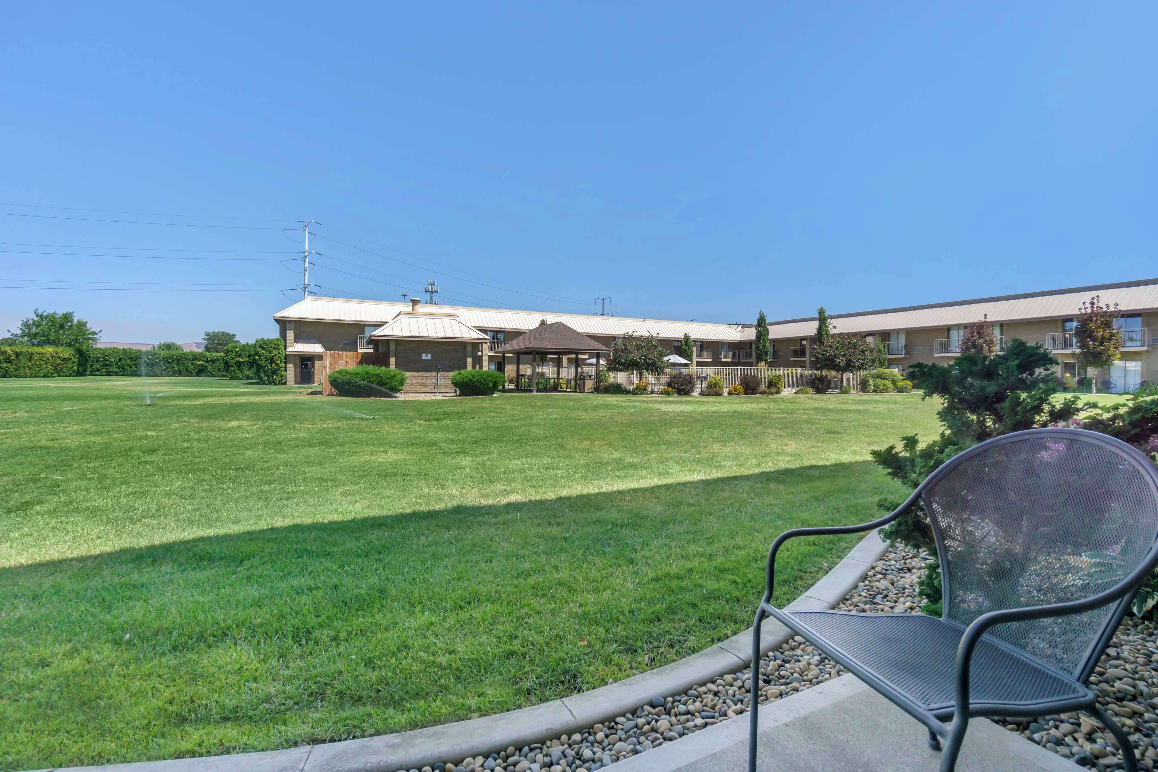 desk, laptop workspace, iron/ironing board, travel cot