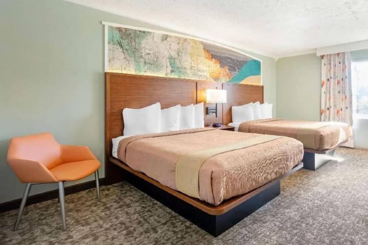 Desk, laptop workspace, iron/ironing board, travel crib