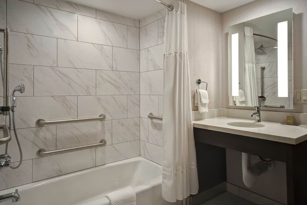 combined shower/bathtub, eco-friendly toiletries, hair dryer, towels