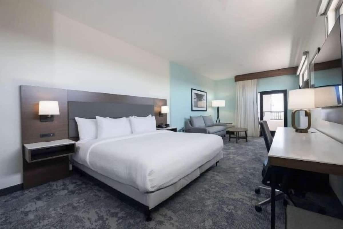 Desk, laptop workspace, blackout drapes, iron/ironing board