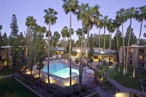 Outdoor pool, open 7:00 AM to 11:00 PM, sun loungers