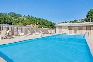 Seasonal outdoor pool, pool loungers