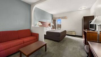 Suite, 1 King Bed with Sofa bed, Non Smoking | Individually furnished, blackout drapes, iron/ironing board