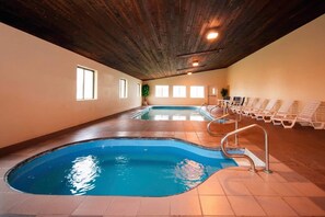 An indoor swimming pool with multiple lanes, a wooden ceiling, and sunlit windows. - Quality Inn Milan - Sandusky (Milan)