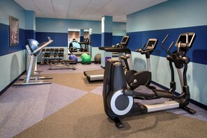 A gym with treadmills, elliptical machines, and exercise balls. - Four Points by Sheraton Charleston (Charleston)