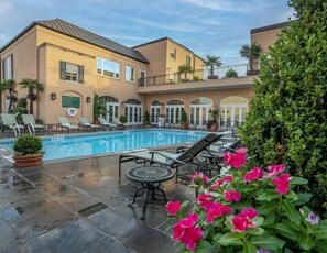 Outdoor pool, open 6:00 AM to 10:00 PM, pool loungers