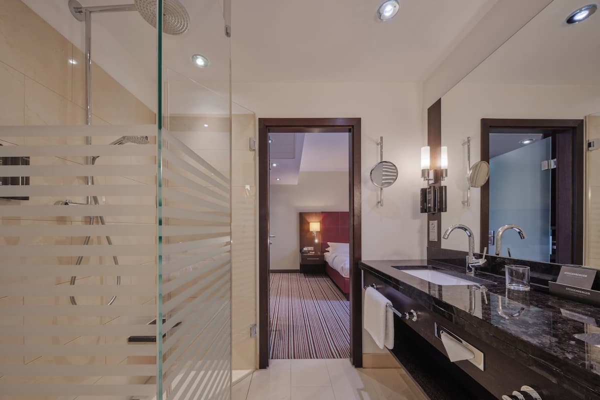 eco-friendly toiletries, hair dryer, bathrobes, slippers