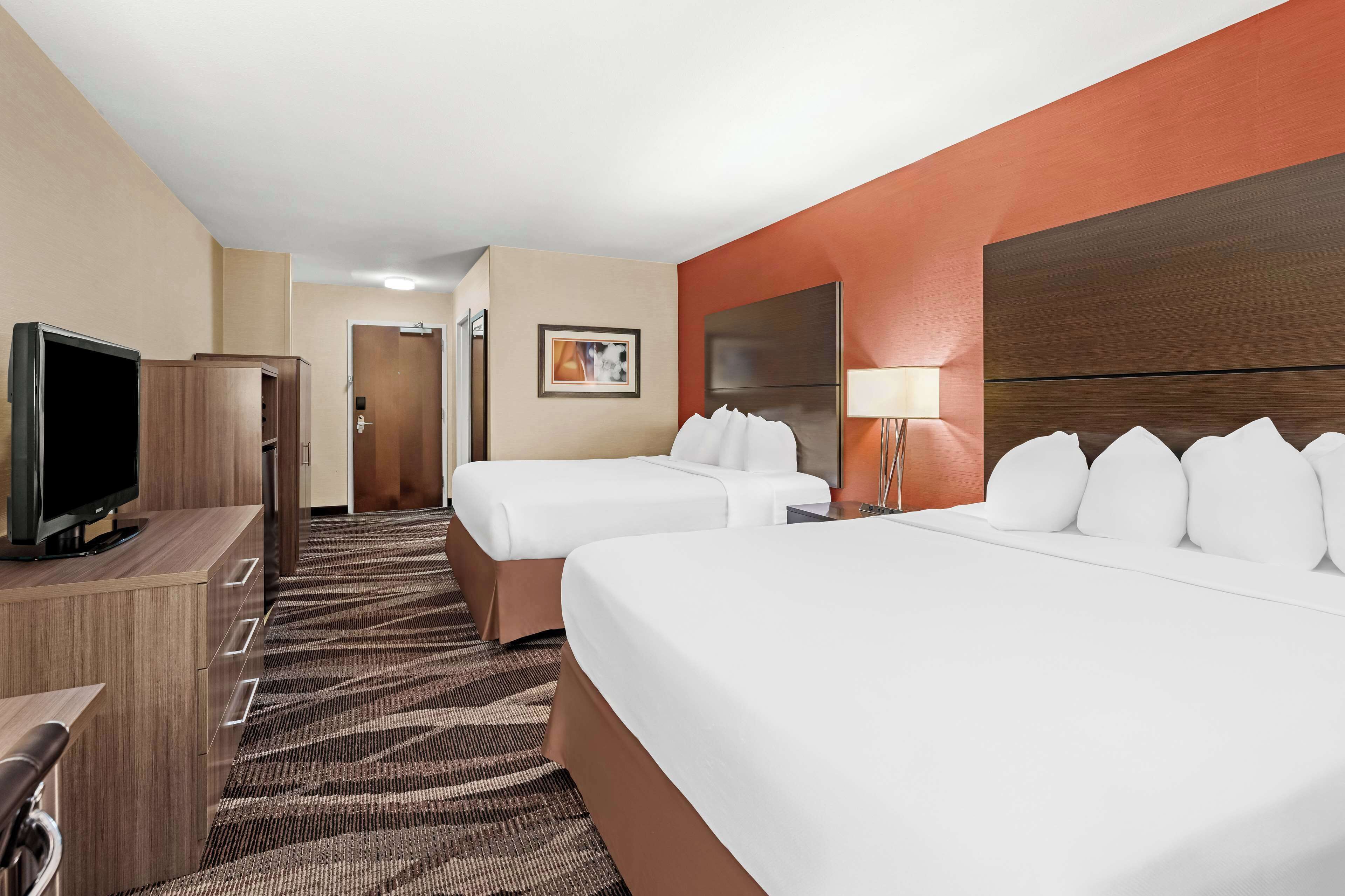 standard room, 2 queen beds, non smoking, refrigerator & microwave | desk, laptop workspace, blackout curtains, iron/ironing board